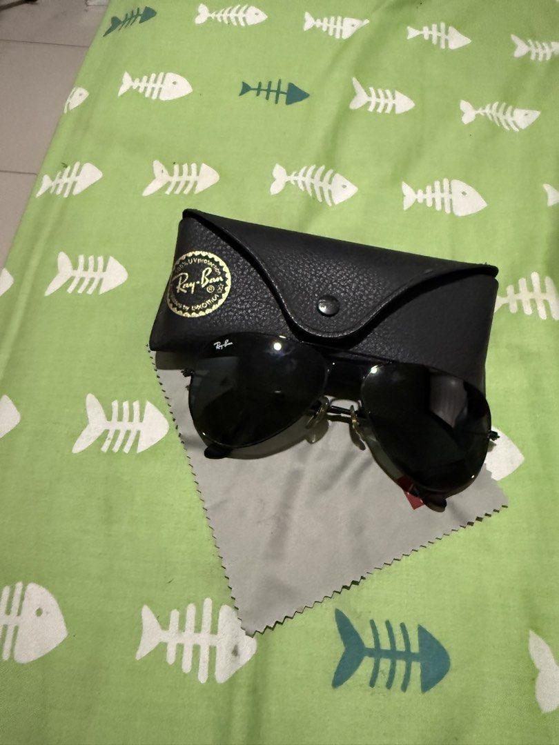 Ray-Ban Aviator Sunglasses with Case and Cloth (Category: Sunglasses & Eyewear) located in Bacoor. Submitted by enigmaann (Listing ID 1470210392, Image 2). Description: - Brand: Ray-Ban Aviator - Frame Color: Classic black - Lenses: Dark - Condition: Minimal wear, excellent and ready to wear - Inclusions: Original leather case and cleaning cloth - Style: Timeless and versatile.