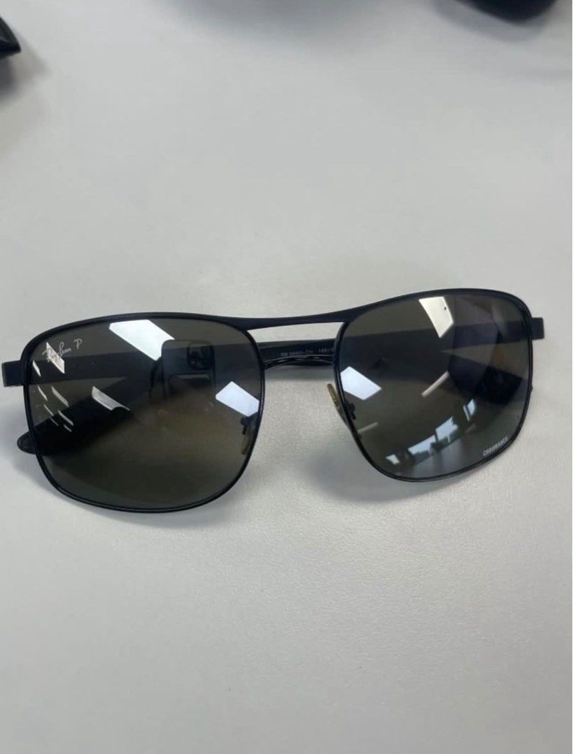 Ray-Ban Chromance Polarized Sunglasses (Category: Sunglasses & Eyewear) located in Quezon City. Submitted by kittytangco (Listing ID 1470345714, Image 2). Description: - Brand: Ray-Ban - Model/Lens Code: RB 3693-CH (visible on bridge) - Lenses: Chromance polarized, scratch-free, and crystal clear - Frame: Sleek black, rectangular shape - Inclusions: Original Ray-Ban leather hard case - negotiable.