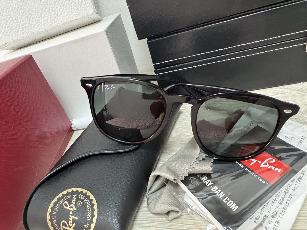 Ray-Ban Sunglasses Black Frame (Category: Sunglasses & Eyewear) located in Caloocan City. Submitted by izzie_finds (Listing ID 1470181124, Image 2). Description: - Brand: Ray-Ban - Style: Classic black frame with dark lenses and silver temple logo - Condition: Excellent, clean with zero scratches on lenses or frame - Inclusions: Original leather case, cleaning cloth, and paperwork .