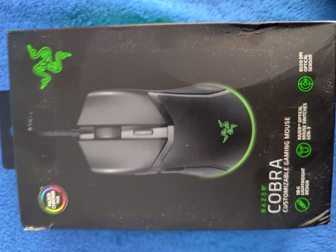 Razer Cobra Mouse (Category: Mouse & Mousepads) located in Manila. Submitted by karu0 (Listing ID 1470269783, Image 2). Description: • Sensor: 8500 DPI Optical Sensor (with 50 DPI granular adjustments) • Max Sensitivity (DPI): 8,500 • Programmable Buttons: 6 • Switch Type: Razer™ Optical Mouse Switches Gen-3 • Mouse Feet: 100% PTFE • RGB Lighting: Razer Chroma™ RGB Used-Good condition Only pickup or meetup Can meetup within the area: Sm clark Sm 