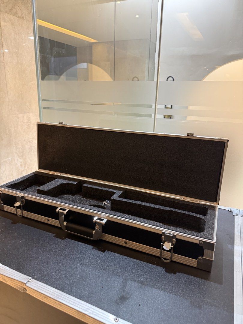 Rectangular Flight Case (Category: Luggage) located in Rodriguez. Submitted by kewpiee.ie403 (Listing ID 1470328860, Image 3). Description: Selling a black, hard-shell equipment flight case with aluminum edging, heavy-duty metal latches, and a built-in handle. Comes with custom-cut foam inserts designed to securely hold and protect specific equipment during storage and transport. Features: * Durable hard-shell construction * Black exterior with a