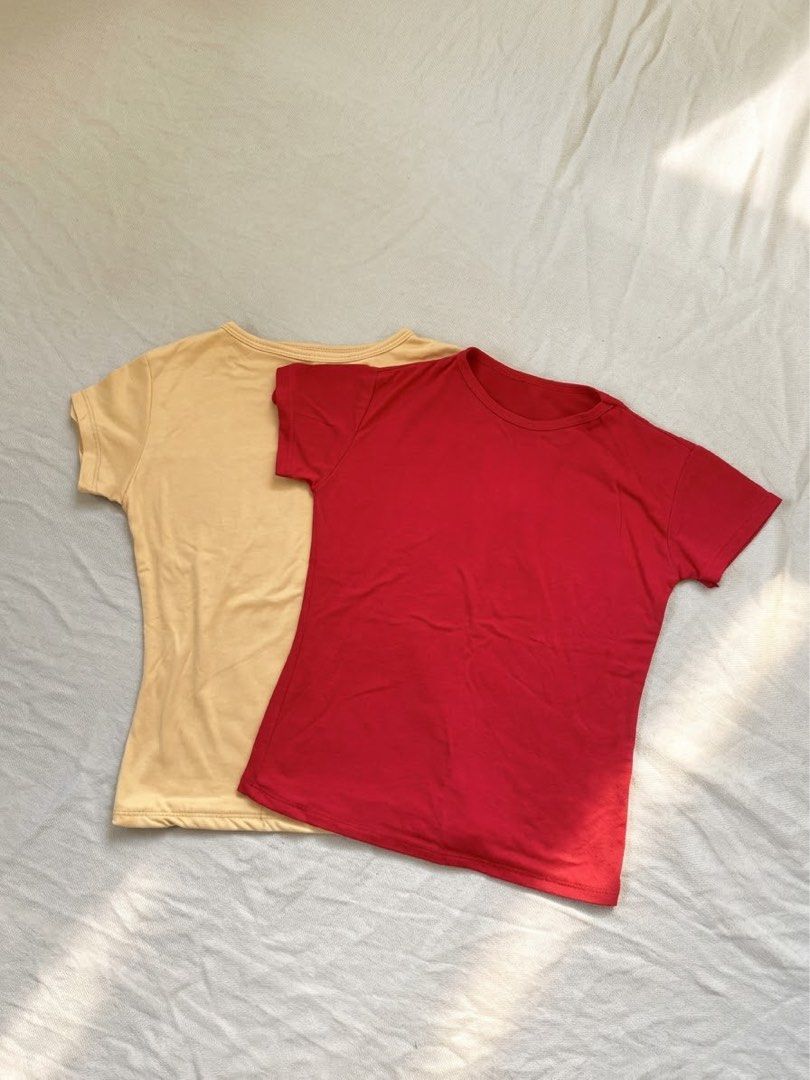 Red and beige short sleeve t-shirts bundle (Category: Shirts) located in Lipa City. Submitted by collbyisidora (Listing ID 1470311585, Image 1). Description: - 2-piece basic t-shirt bundle - Colors: Bright red and mustard beige - Material: Soft, breathable cotton - Design: Short sleeves and round neckline.