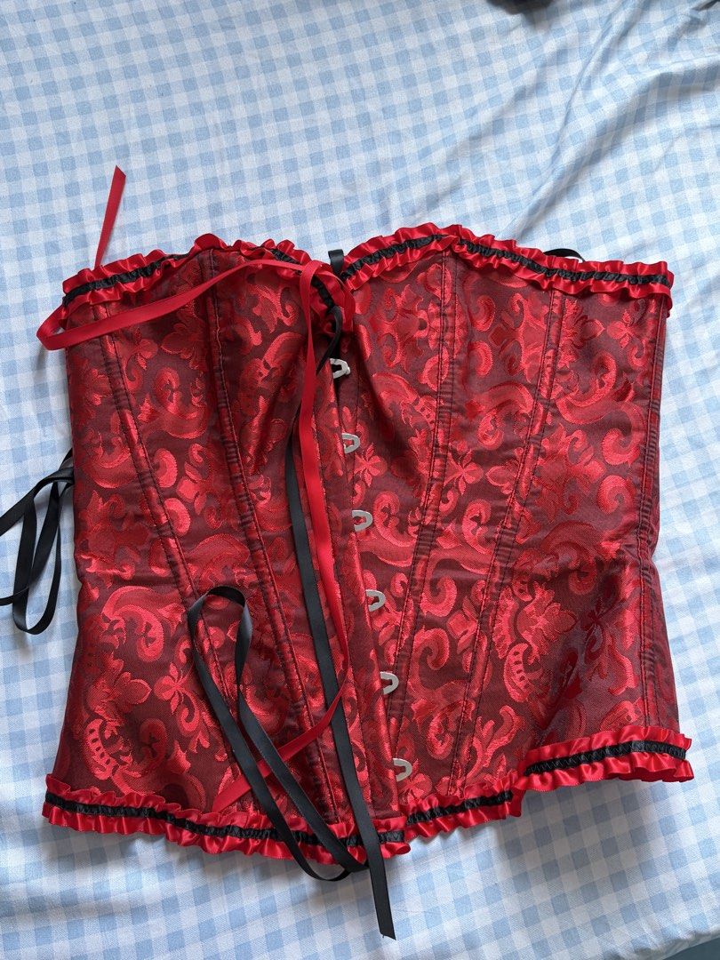 Red Corset Top (Category: Others Tops) located in Manila. Submitted by dwiebadoobeez (Listing ID 1470186566, Image 1). Description: red and black for photoshoots, parties, or halloween! 👀 • Worn only once • In good condition • Size: Please refer to the size chart • RFS: Decluttering.