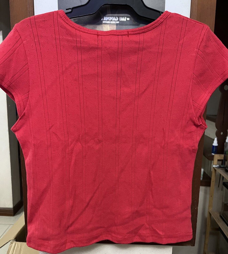 Red crop top (Category: Others Tops) located in Bacoor. Submitted by ayit. (Listing ID 1470267627, Image 2). Description: Xs small fit - Brand: Melior (Korean brand) - Color: Vibrant Red - Size: XS / EU 34 / UK 6 / US 2 - Material: Textured ribbed fabric with subtle pattern - Design: Short sleeves, scoop neck with front split detail - Condition: Layer 3, well-maintained - Style: Casual, trendy crop top perfect for OOTDs.