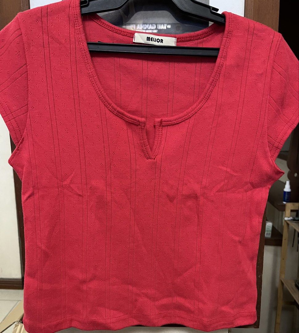 Red crop top (Category: Others Tops) located in Bacoor. Submitted by ayit. (Listing ID 1470267627, Image 1). Description: Xs small fit - Brand: Melior (Korean brand) - Color: Vibrant Red - Size: XS / EU 34 / UK 6 / US 2 - Material: Textured ribbed fabric with subtle pattern - Design: Short sleeves, scoop neck with front split detail - Condition: Layer 3, well-maintained - Style: Casual, trendy crop top perfect for OOTDs.