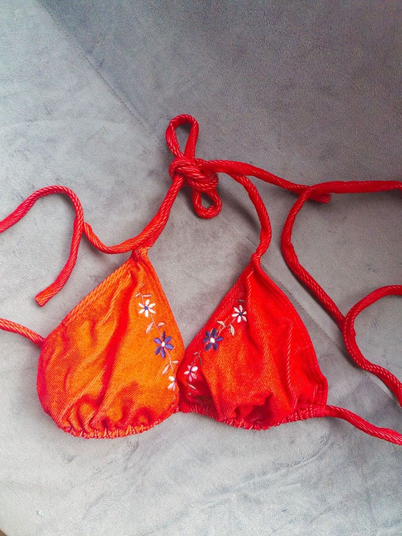 Red Embroidered Halter Bikini Top (Category: Bikinis & Swimsuits) located in Taguig. Submitted by iggysclutter (Listing ID 1470250277, Image 2). Description: - Color: Bright red - Material: Ribbed textured fabric - Design: Embroidered daisy flowers along the straps - Closure: Adjustable ties at the neck and back - Occasion: Ideal for the beach or pool parties.