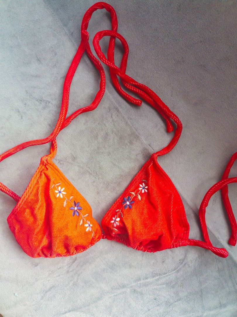 Red Embroidered Halter Bikini Top (Category: Bikinis & Swimsuits) located in Taguig. Submitted by iggysclutter (Listing ID 1470250277, Image 3). Description: - Color: Bright red - Material: Ribbed textured fabric - Design: Embroidered daisy flowers along the straps - Closure: Adjustable ties at the neck and back - Occasion: Ideal for the beach or pool parties.
