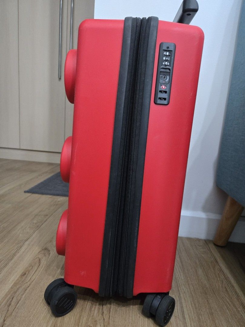 Red LEGO Luggage Suitcase (Category: Luggage) located in Makati City. Submitted by periwinklepop (Listing ID 1470230797, Image 3). Description: - Eye-catching bright red LEGO design with iconic 3D brick studs - Secure built-in TSA combination lock for stress-free travel - Telescopic handle with comfortable black grip and smooth double spinner wheels - Clean grey-lined interior featuring a mesh zippered compartment and elastic packing straps.