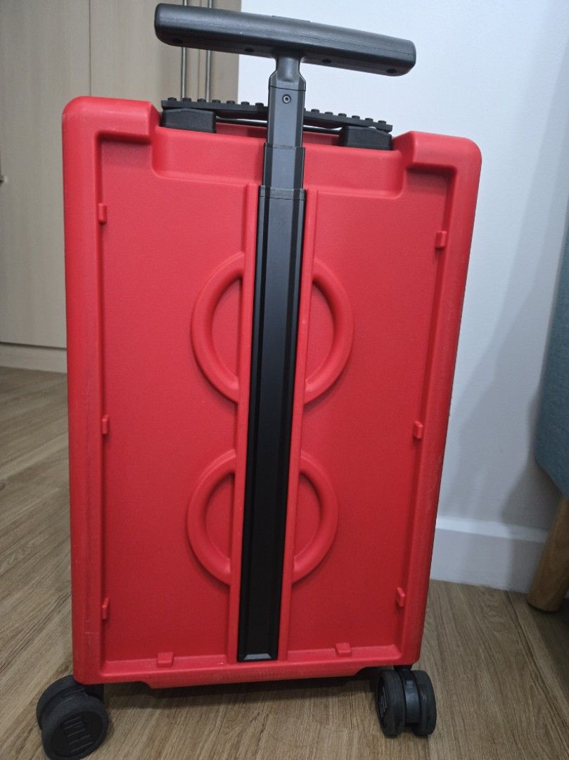 Red LEGO Luggage Suitcase (Category: Luggage) located in Makati City. Submitted by periwinklepop (Listing ID 1470230797, Image 2). Description: - Eye-catching bright red LEGO design with iconic 3D brick studs - Secure built-in TSA combination lock for stress-free travel - Telescopic handle with comfortable black grip and smooth double spinner wheels - Clean grey-lined interior featuring a mesh zippered compartment and elastic packing straps.
