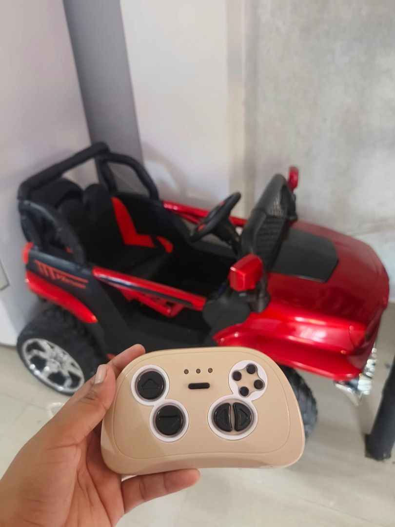 Red Ride-On Electric Toy Car with Remote Control (Category: Remote Control Toys) located in Candon. Submitted by sariecorner (Listing ID 1470220165, Image 3). Description: 2 Months old Electric toy car for kids *REMOTE *MANUAL DRIVE *RUBBER TIRES *LEATHER SEAT *OPEN DOOR 📍Candon City,Ilocos Sur 📍Pwede nila sakyan .