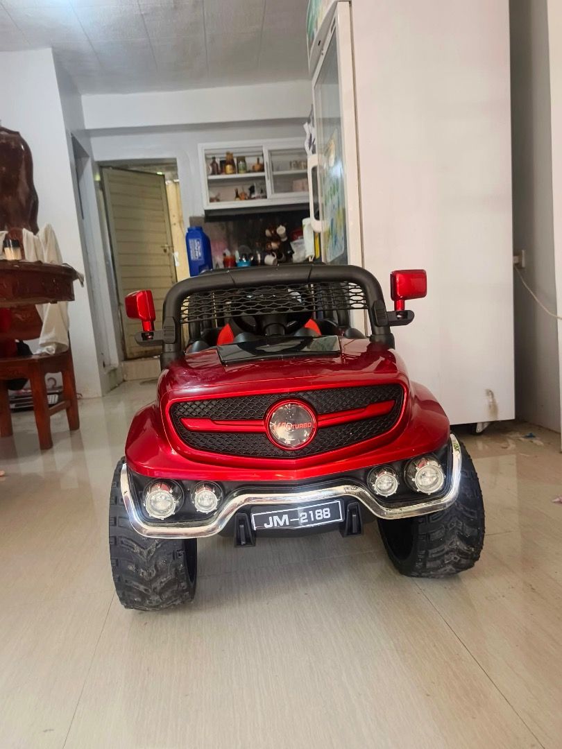 Red Ride-On Electric Toy Car with Remote Control (Category: Remote Control Toys) located in Candon. Submitted by sariecorner (Listing ID 1470220165, Image 2). Description: 2 Months old Electric toy car for kids *REMOTE *MANUAL DRIVE *RUBBER TIRES *LEATHER SEAT *OPEN DOOR 📍Candon City,Ilocos Sur 📍Pwede nila sakyan .