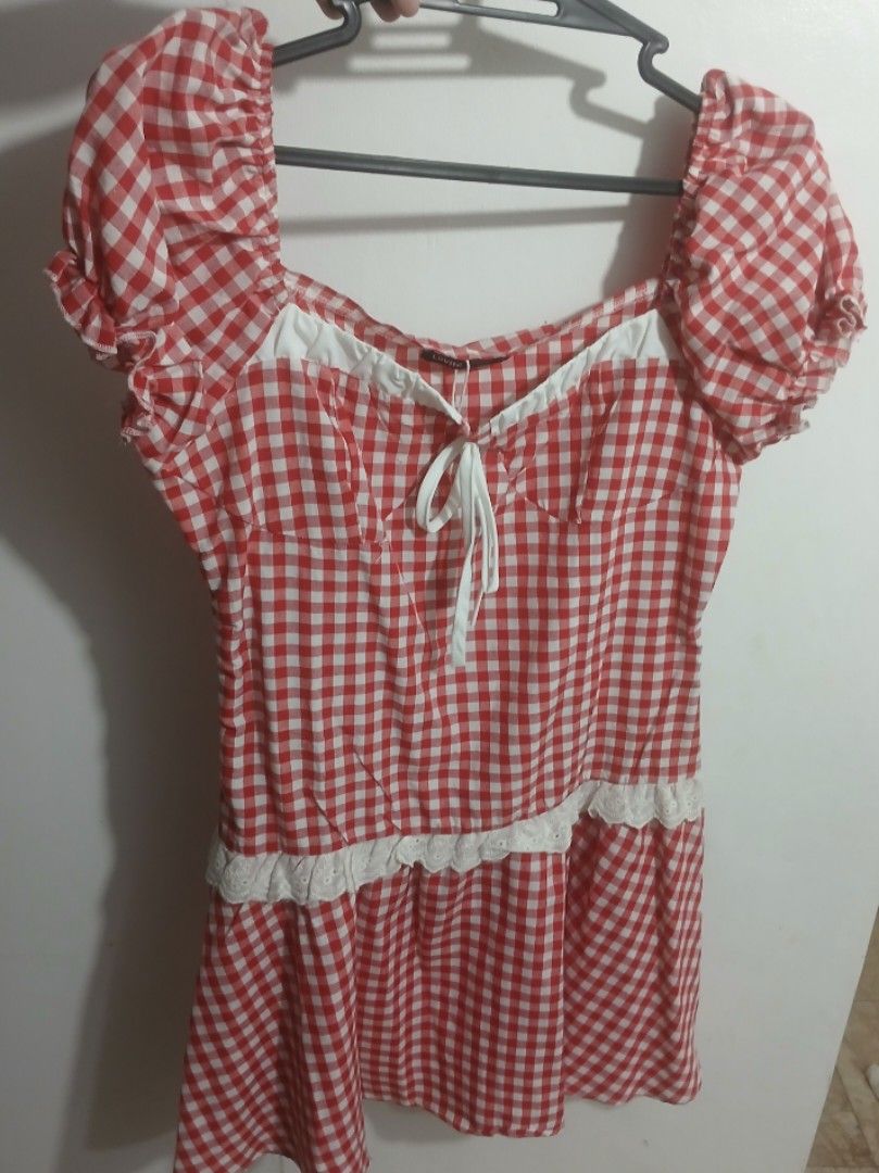 Red White Gingham Checkered Puff Sleeve Blouse (Category: Dresses) located in Los Banos. Submitted by kiezsah (Listing ID 1470257699, Image 1). Description: - Red and white gingham pattern - Sweetheart neckline with front tie ribbon - Short puff sleeves with elastic cuffs - White lace trim on bodice and hem - Ideal for picnics and casual outings - Size: Fits small to medium frames.