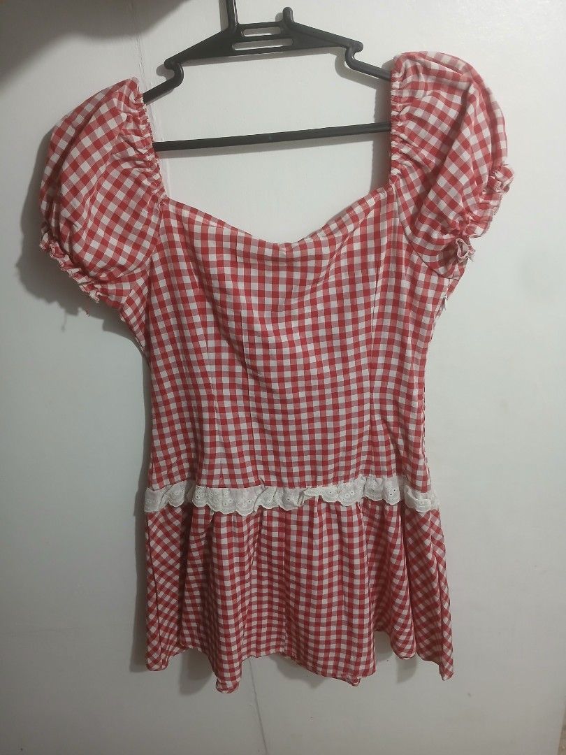 Red White Gingham Checkered Puff Sleeve Blouse (Category: Dresses) located in Los Banos. Submitted by kiezsah (Listing ID 1470257699, Image 2). Description: - Red and white gingham pattern - Sweetheart neckline with front tie ribbon - Short puff sleeves with elastic cuffs - White lace trim on bodice and hem - Ideal for picnics and casual outings - Size: Fits small to medium frames.