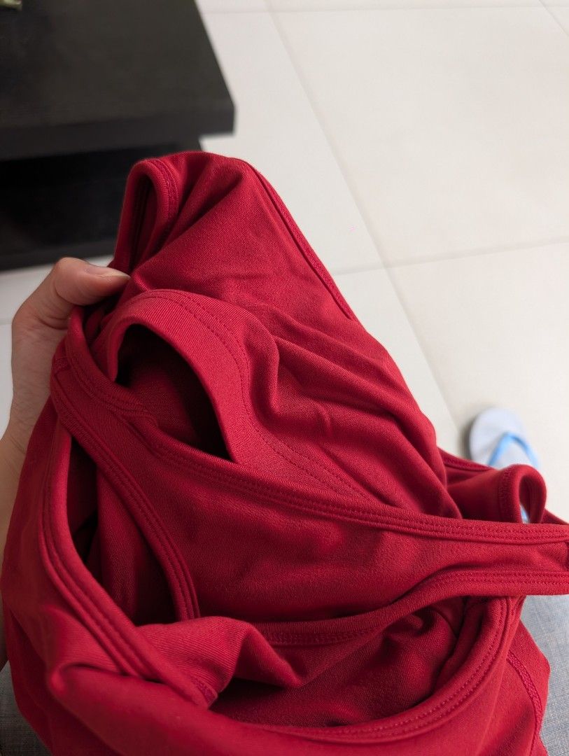 Red Workout Tank Top and Twist Back (Category: Activewear) located in Paranaque City. Submitted by clothingarchives (Listing ID 1470162222, Image 3). Description: - Color: Red - Neckline: Square neckline with built-in bra liner - Design: Stylish twist-back strap detail - Fabric: Breathable, stretch material for easy movement - Ideal for: Gym workouts, running, yoga, and active wear - Fits xs-s, stretchy fabric - Rlly good quality.