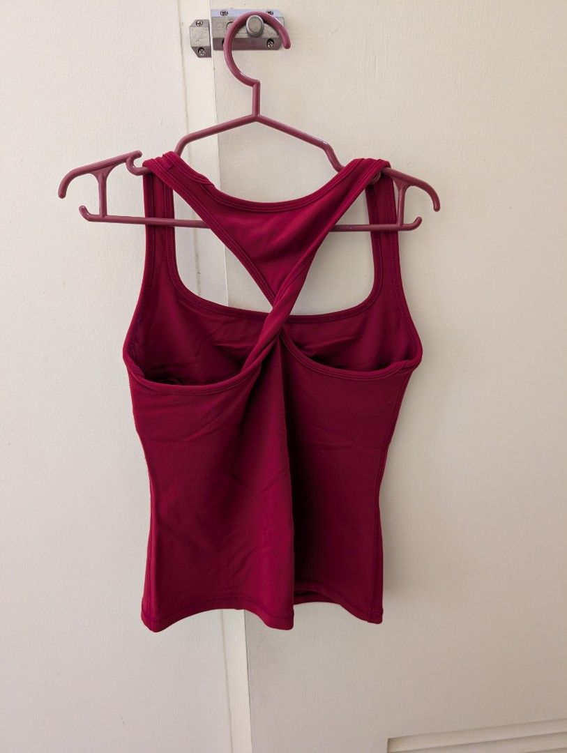 Red Workout Tank Top and Twist Back (Category: Activewear) located in Paranaque City. Submitted by clothingarchives (Listing ID 1470162222, Image 2). Description: - Color: Red - Neckline: Square neckline with built-in bra liner - Design: Stylish twist-back strap detail - Fabric: Breathable, stretch material for easy movement - Ideal for: Gym workouts, running, yoga, and active wear - Fits xs-s, stretchy fabric - Rlly good quality.