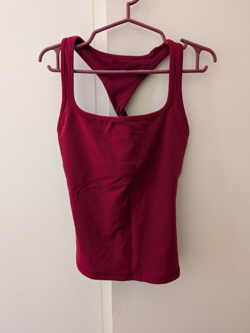 Red Workout Tank Top and Twist Back (Category: Activewear) located in Paranaque City. Submitted by clothingarchives (Listing ID 1470162222, Image 1). Description: - Color: Red - Neckline: Square neckline with built-in bra liner - Design: Stylish twist-back strap detail - Fabric: Breathable, stretch material for easy movement - Ideal for: Gym workouts, running, yoga, and active wear - Fits xs-s, stretchy fabric - Rlly good quality.