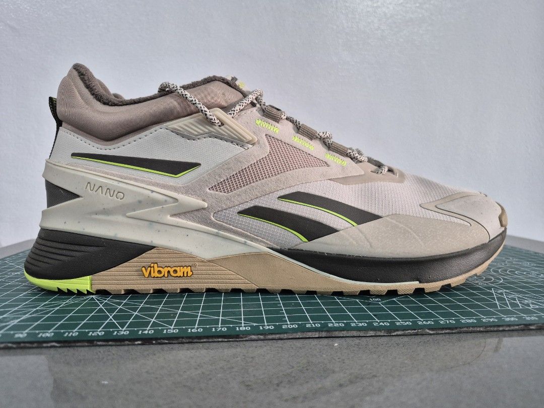 Reebok Nano X Adventure Training Shoes (Category: Sneakers) located in Makati City. Submitted by kennyv7 (Listing ID 1470227303, Image 1). Description: - Brand/Model: Reebok Nano X Adventure - Colorway: Light beige and brown with striking neon yellow accents - Outsole: Durable Vibram rubber with high traction and hardly any tread wear - Features: Thick rope laces, padded collar, and excellent grip - Best For: Outdoor workouts, trail running, gym 