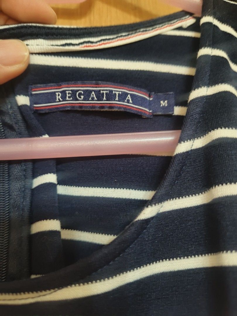 Regatta dress (Category: Dresses) located in Quezon City. Submitted by majasaw88 (Listing ID 1470207401, Image 2). Description: Preloved Regatta looks news - Brand: Regatta - Size: Medium - Color: Navy blue and white stripes - Style: Sleeveless, scoop neckline, flared skater skirt - Closure: Back zipper - Material: Stretchy, comfortable fabric - Condition: Great for casual wear and warm days.