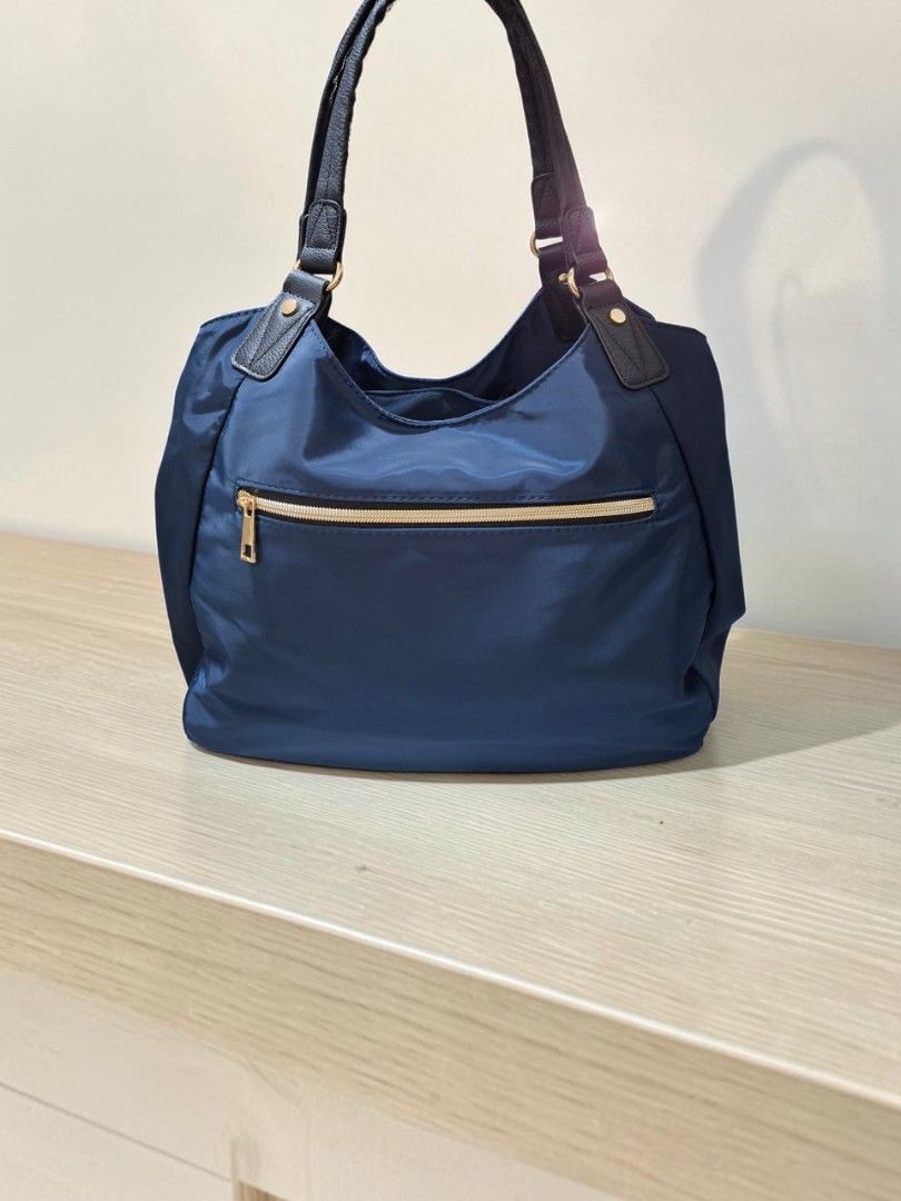 RENAME NYLON HOBO BAG (Category: Shoulder Bags) located in Las Pinas. Submitted by annachiaonair2037 (Listing ID 1470142840, Image 3). Description: RENAME NYLON HOBO BAG FROM JAPAN 3 COMPARTMENTS THICK NYLON WATERPROOF H 11" L 15" W 6" Disclaimer: I am not affiliated with, associated with, or authorized by any of the brands featured posted. Any mention of brand names, trademarks, or logos is solely for identification and reference purposes only..