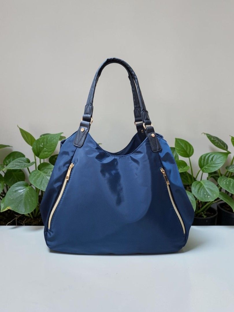 RENAME NYLON HOBO BAG (Category: Shoulder Bags) located in Las Pinas. Submitted by annachiaonair2037 (Listing ID 1470142840, Image 2). Description: RENAME NYLON HOBO BAG FROM JAPAN 3 COMPARTMENTS THICK NYLON WATERPROOF H 11" L 15" W 6" Disclaimer: I am not affiliated with, associated with, or authorized by any of the brands featured posted. Any mention of brand names, trademarks, or logos is solely for identification and reference purposes only..