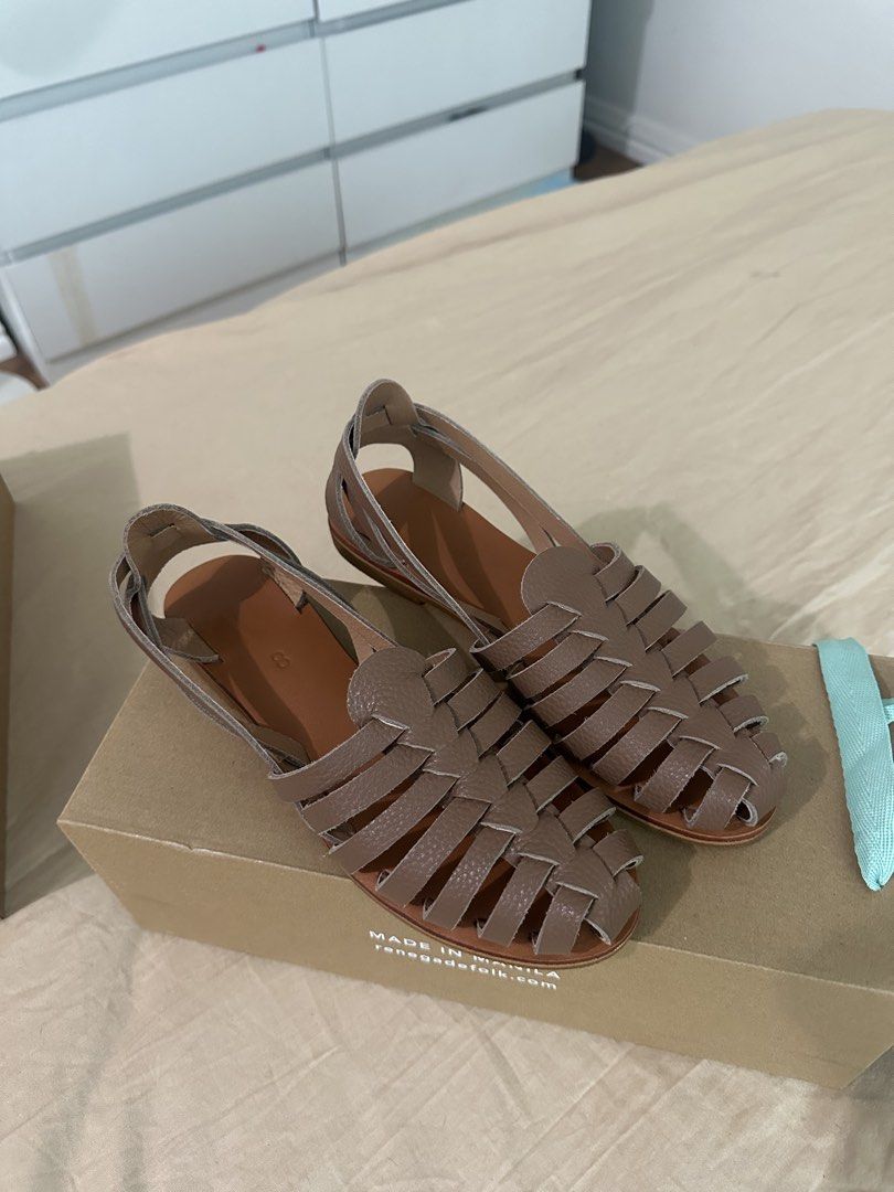 Renegade Folk Woven Leather Sandals (Category: Flats & Sandals) located in Quezon City. Submitted by kittytangco (Listing ID 1470347995, Image 2). Description: - Brand: Renegade Folk - Style: Woven leather strap flat sandals with open back and ankle strap - Color: Versatile taupe brown - Condition: Brand new, never worn out, pristine condition - Comfort: Features a soft, cushioned footbed for all-day wear - Inclusions: Comes with original branded