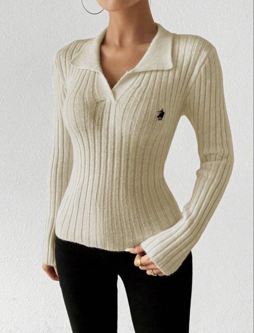 Ribbed Collared Long Sleeve Knit Top (Category: Longsleeves) located in Manila. Submitted by angelyelsha (Listing ID 1470154848, Image 1). Description: - Color: Cream/Khaki - Style: Fitted ribbed knit with pointed collar and V-neck - Details: Long sleeves with flared cuffs, small embroidered logo on chest - Material: Soft, fuzzy, and stretchy fabric - Condition: Excellent - Perfect for effortless layering or chic solo wear.