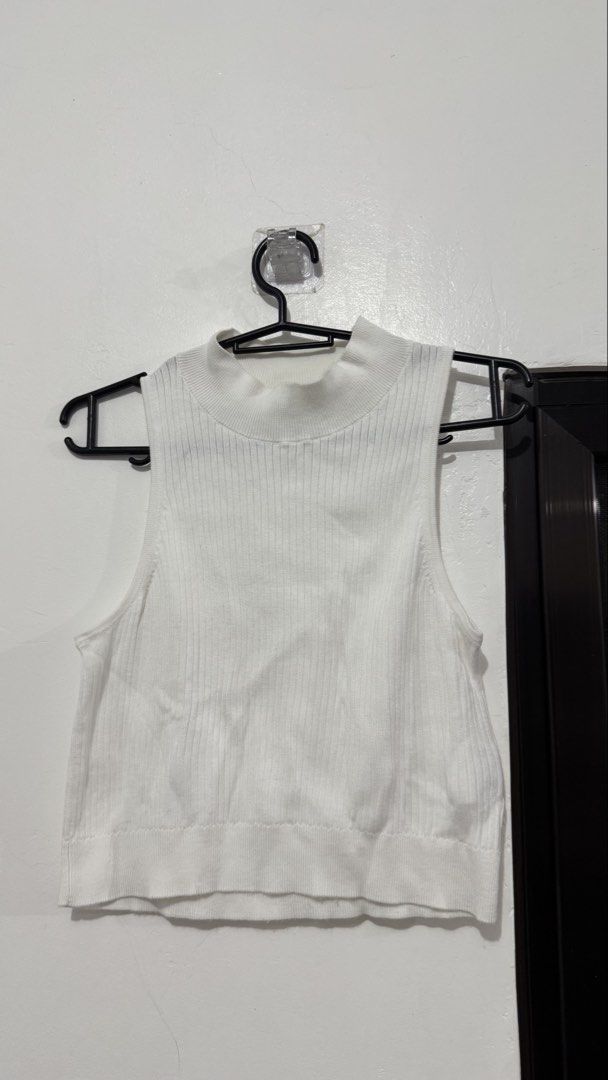 Ribbed High-Neck Knit Crop Tank Top (Category: Sleeveless) located in Muntinlupa City. Submitted by maraaalpz (Listing ID 1470272432, Image 2). Description: - Selling for 100 each - sleeveless tops (Black, White, Sage Green) - Trendy mock neck design with a flattering cropped length - Soft and stretchy ribbed knit material for all-day comfort - Essential basic pieces great for layering or wearing on their own - Super easy to match with your favor