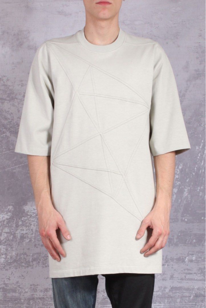 Rick Owens Babel SS19 Jumbo Tee (Category: Activewear) located in Manila. Submitted by walter_wt (Listing ID 1470247352, Image 1). Description: Rick Owens Babel ss19 Geometric Seam T-Shirt – Oyster Pearl Tagged Size: XS Measurement: Length: 33 Width: 21 Shoulder: 15 Sleeve length: 14 -Rick Owens short-sleeve cotton T-shirt in oyster pearl grey. -Features an intricate geometric panel construction with angular contrast stitching throughout the fron