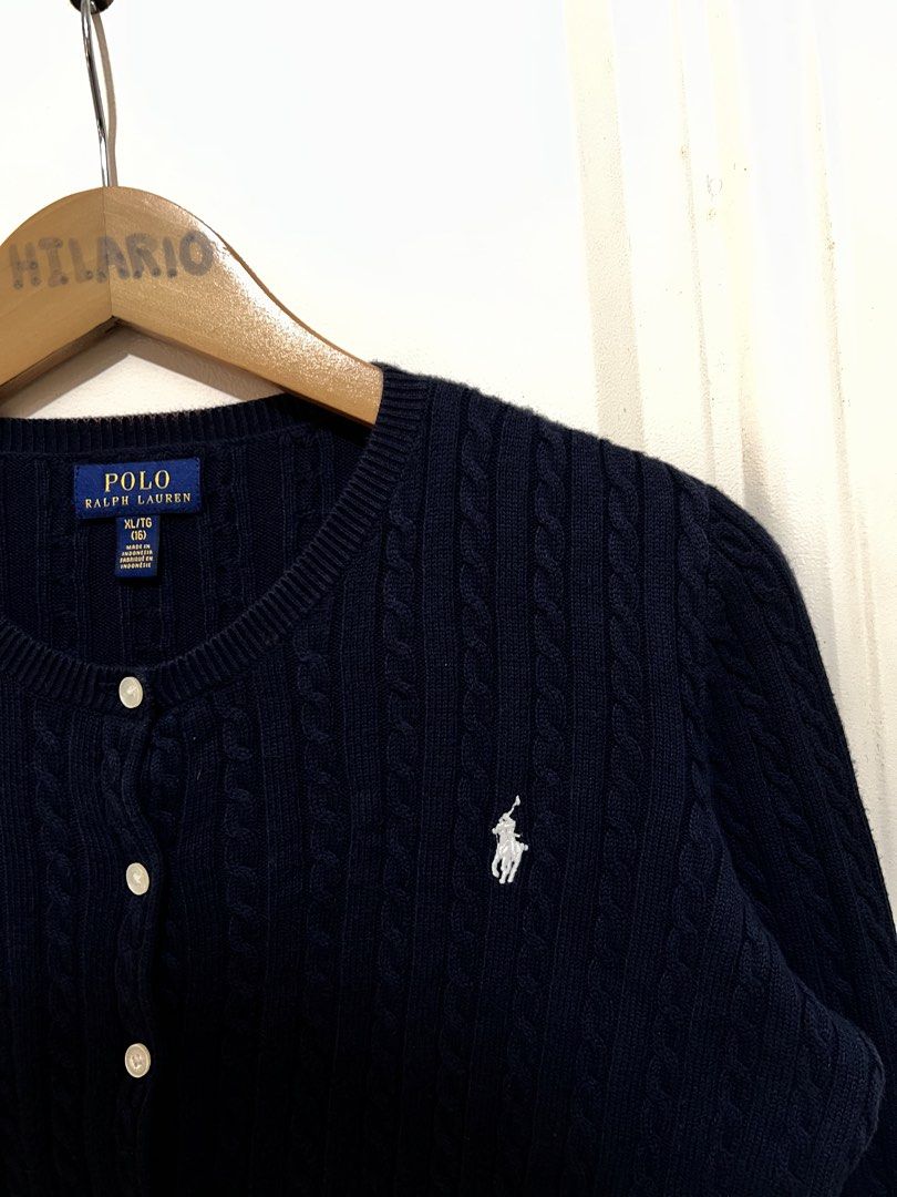 RL Cable Knitted Cardigan Navy Blue (Category: Coats, Jackets and Outerwear) located in San Pedro. Submitted by _eyamarieii (Listing ID 1470334693, Image 2). Description: RL Cable Knitted Cardigan Lightly used condition Color rate 9/10 No issue Size L (16) ontag Fitting size Small women's Width 19.5 Length 20.5 • 1,250+sf.