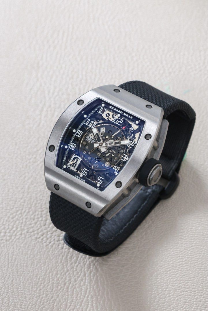 RM 010 Ti (Category: Luxury Watches) located in Makati City. Submitted by vintage.grail (Listing ID 1470178619, Image 2). Description: Richard Mille 010 Titanium Year 2025 Complete set with extra black strap Excellent condition 9.5/10 Priced at Php 10,000,000 DM or Call us to reserve. Available for viewing at Vintage Grail, The Peninsula Manila.