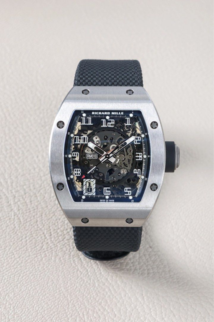 RM 010 Ti (Category: Luxury Watches) located in Makati City. Submitted by vintage.grail (Listing ID 1470178619, Image 1). Description: Richard Mille 010 Titanium Year 2025 Complete set with extra black strap Excellent condition 9.5/10 Priced at Php 10,000,000 DM or Call us to reserve. Available for viewing at Vintage Grail, The Peninsula Manila.