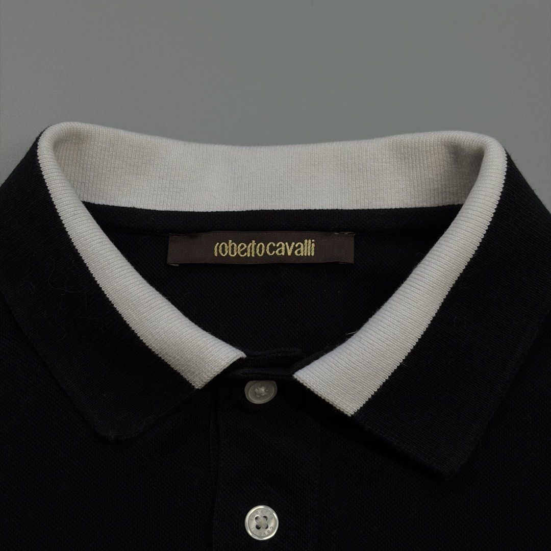 Roberto Cavalli Poloshirt (Authentic) (Category: Luxury Apparel) located in Cavite. Submitted by onebeancent (Listing ID 1470345301, Image 3). Description: Size: Medium Dimension: 19" Width | 26" Length Color: Black Color Rate: 10/10 Issue: None Condition: Like new‼️ Price: 1,080php Additional Shipping Fee (J&T Small Pouch) 75php Luzon 100php visayas 120php mindanao.