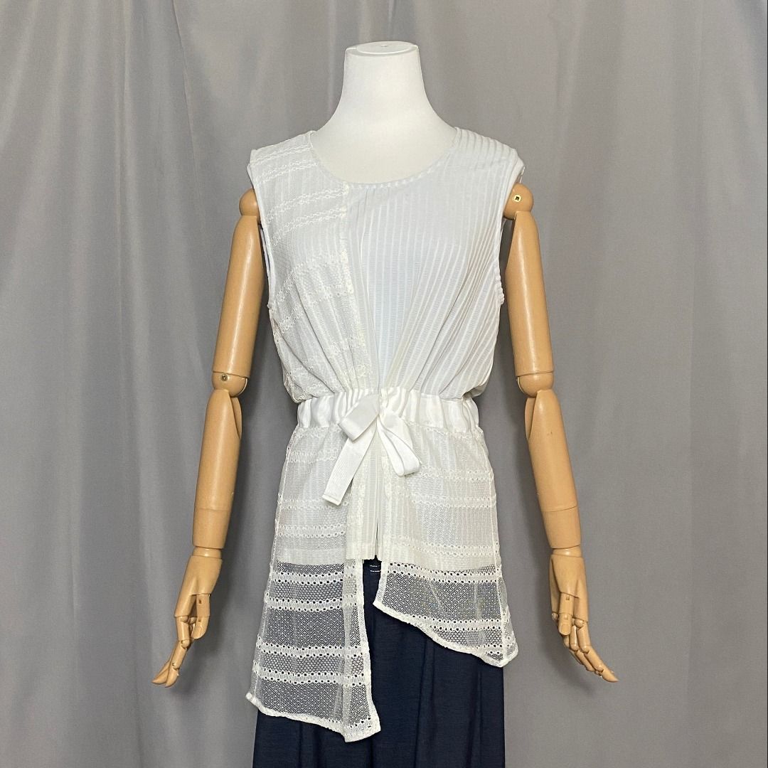 Rococo sleeveless asymmetrical top (Category: Sleeveless) located in Las Pinas. Submitted by ipickyou (Listing ID 1470282476, Image 1). Description: Unwashed Condition: 10/10 𝗠𝗲𝗮𝘀𝘂𝗿𝗲𝗺𝗲𝗻𝘁𝘀 𝘄𝗵𝗲𝗻 𝗹𝗮𝗶𝗱 𝗳𝗹𝗮𝘁: -Size M -Armpit to armpit: 18 1/2” -Length: 32 1/2” .