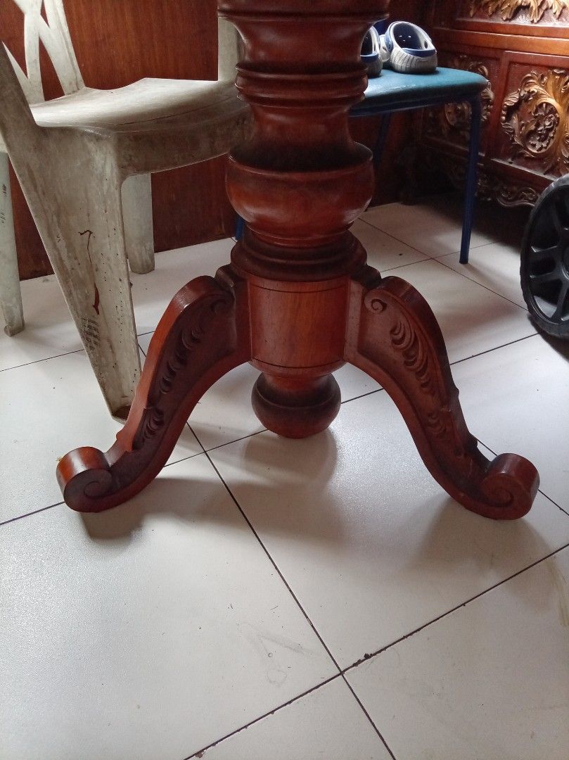 Round Wooden Dining Table With Pedestal Base (Category: Tables & Sets) located in Caloocan City. Submitted by maynaito (Listing ID 1470165809, Image 2). Description: - Solid wood round table with a rich, beautiful grain top - Heavy carved pedestal base featuring classic scroll legs - Generous surface space, perfect for meals and gatherings - Sturdy and durable construction - Shows minor surface wear on the tabletop from regular use.