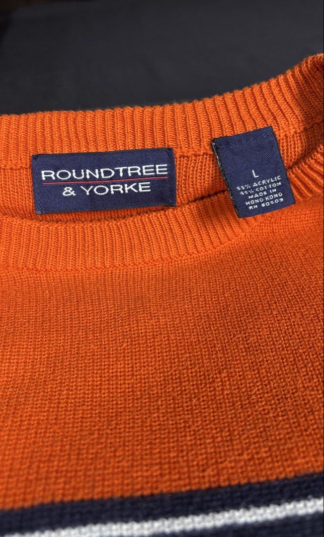 Roundtree & Yorke Colorblock Crewneck Sweater (Category: Coats, Jackets and Outerwear) located in Bacoor. Submitted by calvinmanzano13 (Listing ID 1470196452, Image 2). Description: - L = 27.5” | W = 22” - Color: Orange and navy blue - Design: Striped chevron detail across chest and sleeves - Details: Long sleeves, ribbed crew neckline - Material: 55% acrylic, 45% cotton - Origin: Made in Hong Kong Notes: 🔥 Hand washed 🔥 Polished 🔥 Steam irone