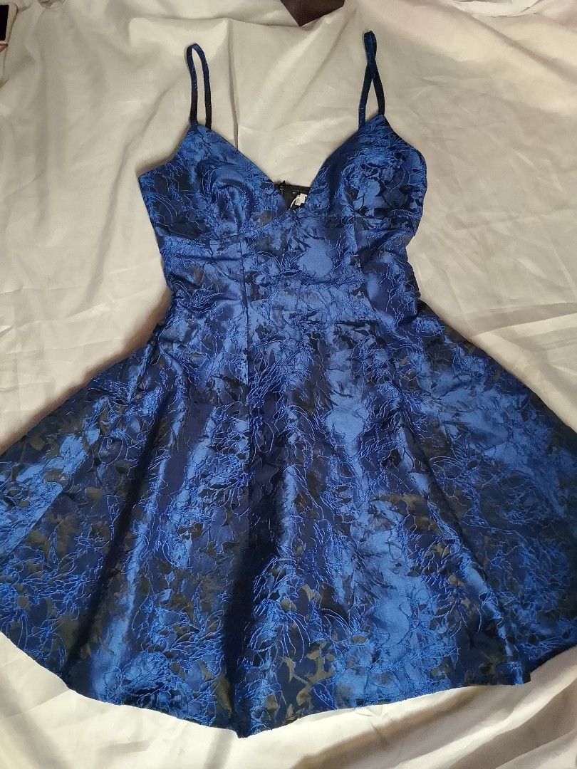 Royal blue floral pattern spaghetti strap mini dress (Category: Dresses) located in Manila. Submitted by star_closet_ (Listing ID 1470196365, Image 1). Description: - Color: Stunning royal blue - Design: Subtle all-over floral brocade pattern - Fit: Fitted bodice with a flared mini skirt shape - Neckline & Straps: V-neckline with thin spaghetti straps - Closure: Convenient back zipper - Condition: Brand new / Excellent (ready to wear!) - Mode of 