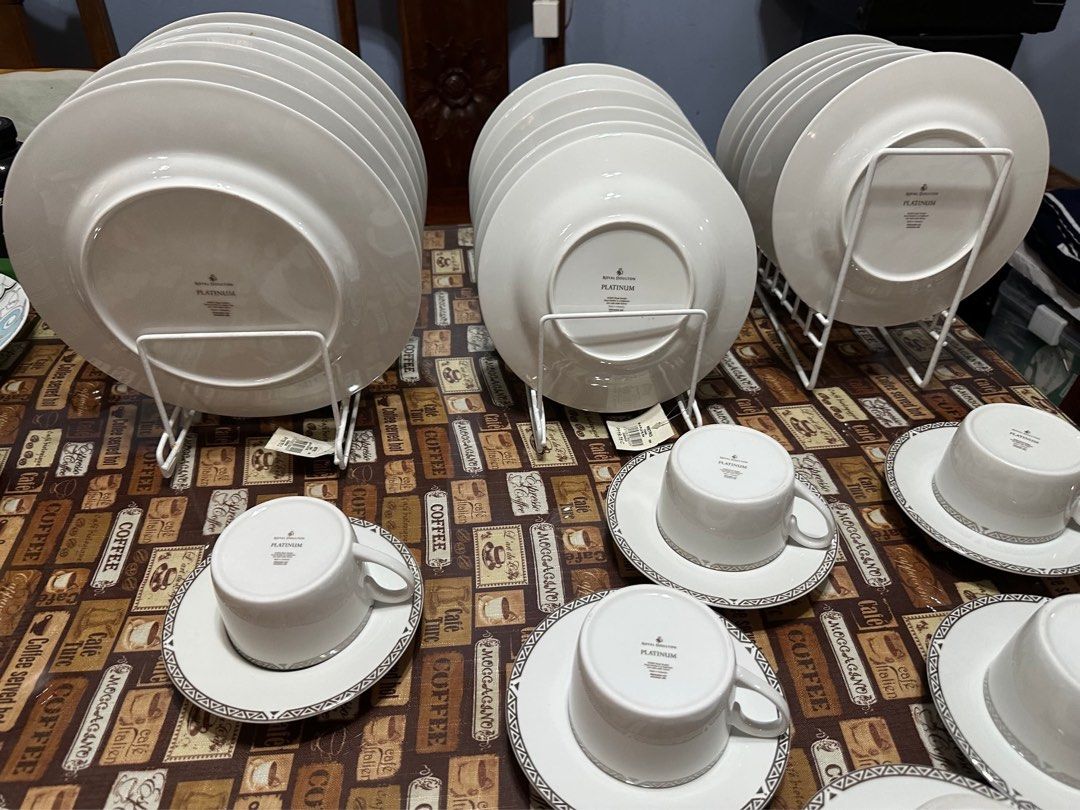 Royal Doulton Platinum Dinnerware Set Cups Saucers Plates (Category: Dinnerware & Cutlery) located in Mandaue City. Submitted by erin_grace (Listing ID 1470167607, Image 3). Description: - Brand/Pattern: Royal Doulton Platinum (© 2004, made in Indonesia) - Material: Premium white porcelain - Design: Modern geometric grey and silver rims - Set Includes: Large plates, medium plates, cups, and matching saucers - Care: Dishwasher and microwave safe -