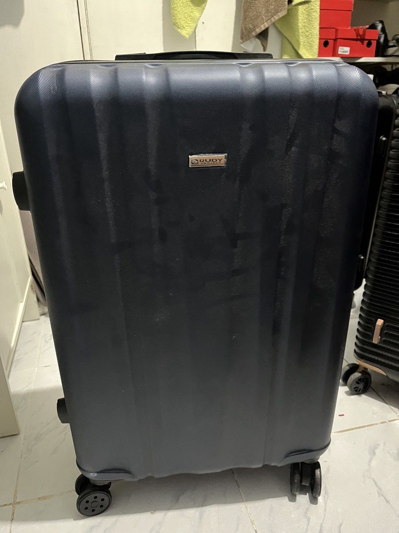 Rudy project luggage (Category: Luggage) located in Marikina City. Submitted by patpatndls (Listing ID 1470271291, Image 1). Description: - Brand: Rudy Project - Size: Medium (approx. 23-24 inches) - Color: Dark blue/black - Material: Durable hardcase exterior - Security: Built-in TSA lock - Interior: Clean grey lining with Rudy Project branding, mesh compartments, and cross straps - Mobility: Smooth-rolling wheels - Condition: Good (4/5) - Meetu