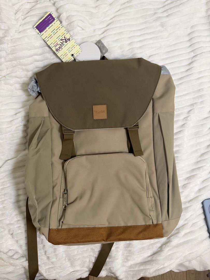 Ruffles by Co Co Beige Brown Flap Backpack Bag (Category: Backpacks) located in Rizal. Submitted by kianapreloves (Listing ID 1470221526, Image 1). Description: - Brand: Ruffles by Co Co (Brand tags still attached) - Color: Chic beige and brown - Closure: Flap top with secure drawstring inner cinch - Pockets: Front zip pocket, interior zippered mesh pocket, and extra organization slots - Comfort & Safety: Padded shoulder straps equipped with refl