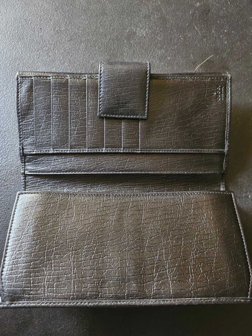 RUSH! Gucci Monogram Continental Flap Long Wallet (Category: Luxury Bags & Wallets) located in Pasig City. Submitted by allstarkenny25 (Listing ID 1470204235, Image 3). Description: - Brand: Gucci - Style: Long wallet - Material: Black monogram canvas and textured leather - Design: Iconic red and green web stripe with gold-tone hardware clasp - Interior: Multiple card slots and spacious cash compartments with stamped Gucci logo - Condition: Class