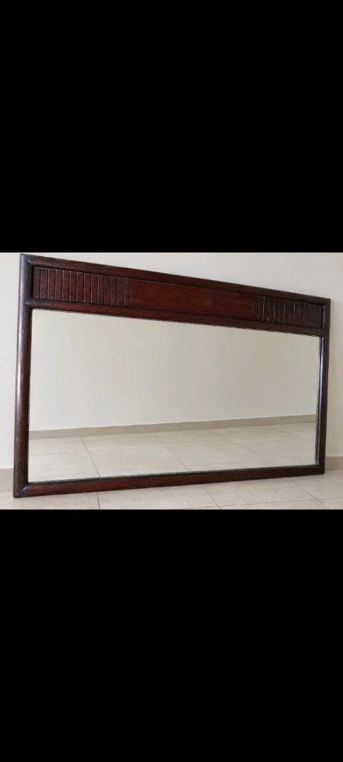RUSH: Vintage Large Wall Mirror with carved top panel (Category: Mirrors) located in San Juan City. Submitted by beatricevee (Listing ID 1470225643, Image 1). Description: Big mirror for Sala or Big Bedroom Size : 60" width and 30" height BUYER CAN PICK UP OR THRU LALAMOVE DELIVERY - Type: Large horizontal wall-mounted mirror - Finish: Dark brown with heavy solid wood frame - Design: Vintage style with vertical carved lines on the top border - Co