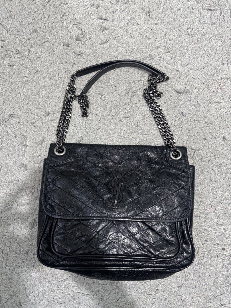 Saint Laurent Niki Medium Chain Bag Black (Category: Luxury Bags & Wallets) located in Baguio. Submitted by luxurysales2600 (Listing ID 1470158017, Image 1). Description: - Brand: Saint Laurent (YSL) - Material: Black crinkled leather with chevron quilting - Hardware: Dark ruthenium-tone with iconic YSL monogram - Straps: Versatile sliding chain straps with comfortable leather pads - Closure: Secure magnetic closure under front flap - Interior: F
