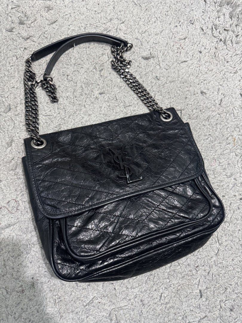 Saint Laurent Niki Medium Chain Bag Black (Category: Luxury Bags & Wallets) located in Baguio. Submitted by luxurysales2600 (Listing ID 1470158017, Image 2). Description: - Brand: Saint Laurent (YSL) - Material: Black crinkled leather with chevron quilting - Hardware: Dark ruthenium-tone with iconic YSL monogram - Straps: Versatile sliding chain straps with comfortable leather pads - Closure: Secure magnetic closure under front flap - Interior: F