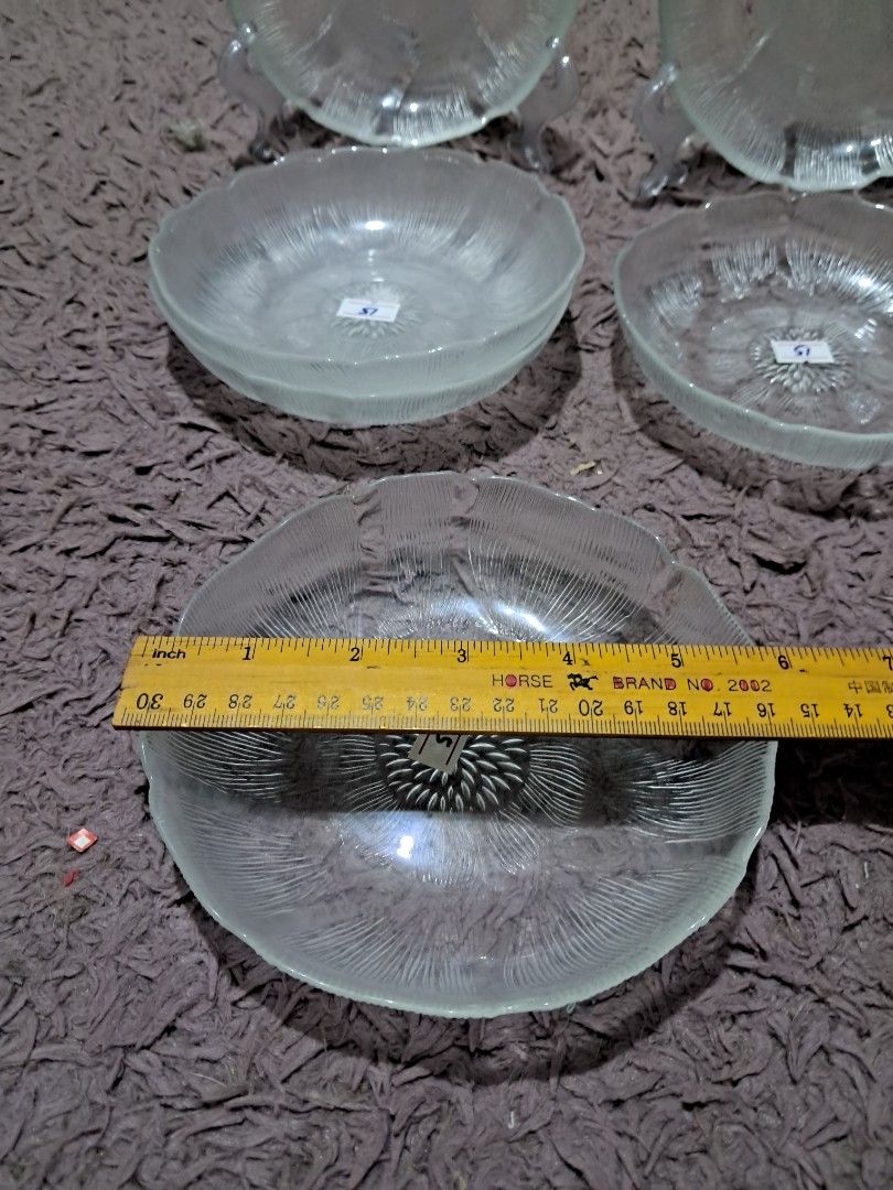 Salad plate 21 pcs available (Category: Dinnerware & Cutlery) located in Cavite. Submitted by secretjapansurplus (Listing ID 1470246099, Image 3). Description: 21 pcs available • Authentic Vintage: Genuine retro pressed glassware featuring an elegant floral radial petal design with scalloped edges. • Dimensions: Includes individual serving bowls measuring approximately 6.25 to 6.5 inches in diameter and 1.5 inches in depth, along with matching ac