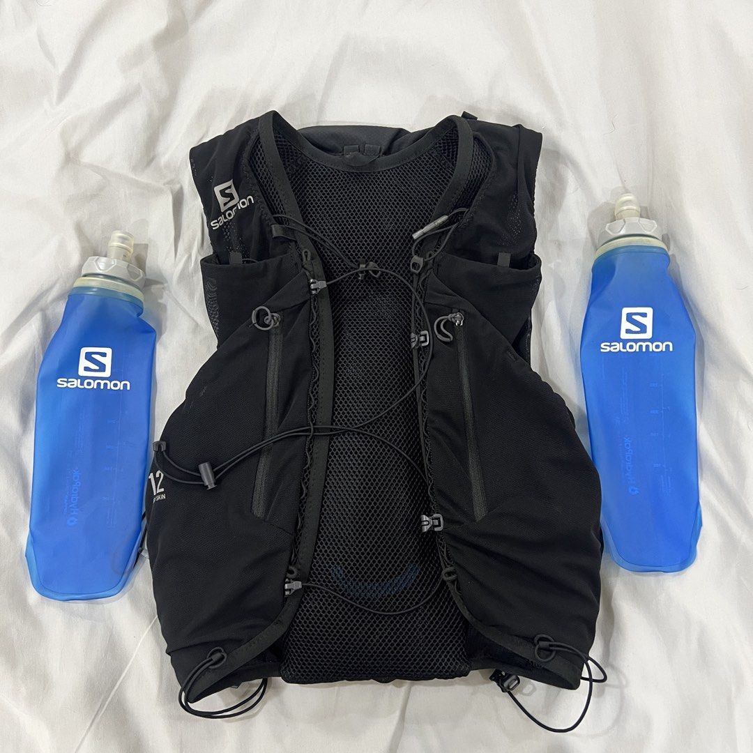 Salomon ADV Skin 12 Hydration Vest with Soft Flasks (Category: Activewear) located in Manila. Submitted by wynddd (Listing ID 1470293688, Image 2). Description: - Brand: Salomon - Model: ADV Skin 12 Vest - Color: Black - Size: XS (Chest: 81.5-89 cm / 32-35 inches) - Inclusions: Two 500ml HydraPak soft flasks - Features: Breathable mesh construction, multiple front pockets - Condition: Clean and ready for your next trail run or marathon Bought in 