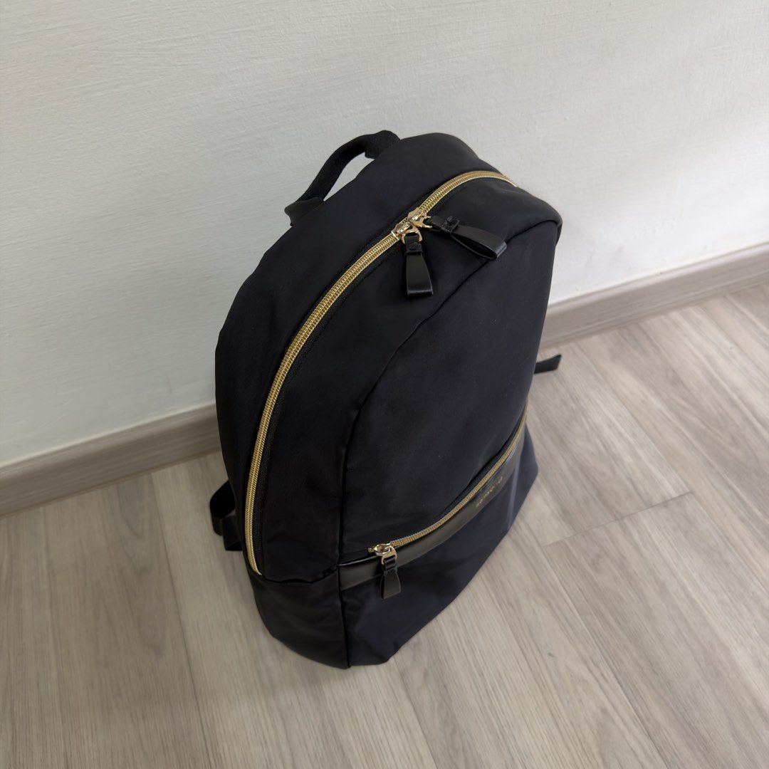 Samsonite Backpack (Category: Backpacks) located in Singapore. Submitted by carousae (Listing ID 1470236243, Image 3). Description: - Color: Classic black with elegant gold hardware zippers - Dimensions: 290 mm (W) x 400 mm (H) x 160 mm (D) - Features: Spacious main compartment, front zip pocket, adjustable shoulder straps, and top grab handle - Good condition with minimal wear - Free tracked mail.