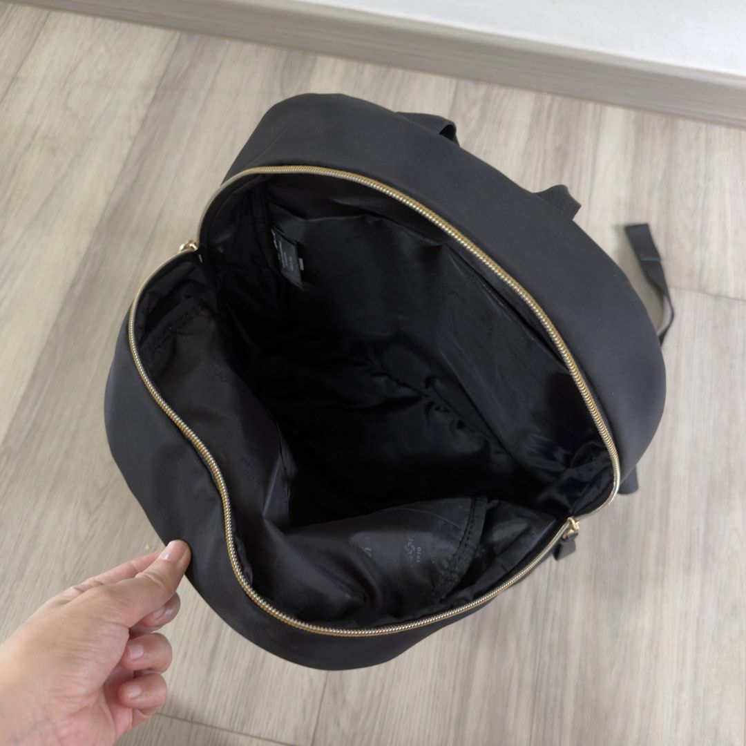 Samsonite Backpack (Category: Backpacks) located in Singapore. Submitted by carousae (Listing ID 1470236243, Image 4). Description: - Color: Classic black with elegant gold hardware zippers - Dimensions: 290 mm (W) x 400 mm (H) x 160 mm (D) - Features: Spacious main compartment, front zip pocket, adjustable shoulder straps, and top grab handle - Good condition with minimal wear - Free tracked mail.