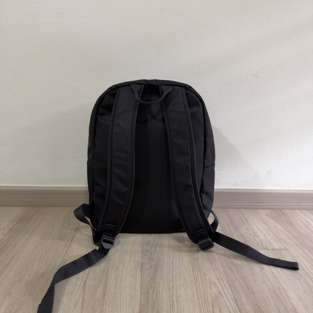 Samsonite Backpack (Category: Backpacks) located in Singapore. Submitted by carousae (Listing ID 1470236243, Image 2). Description: - Color: Classic black with elegant gold hardware zippers - Dimensions: 290 mm (W) x 400 mm (H) x 160 mm (D) - Features: Spacious main compartment, front zip pocket, adjustable shoulder straps, and top grab handle - Good condition with minimal wear - Free tracked mail.