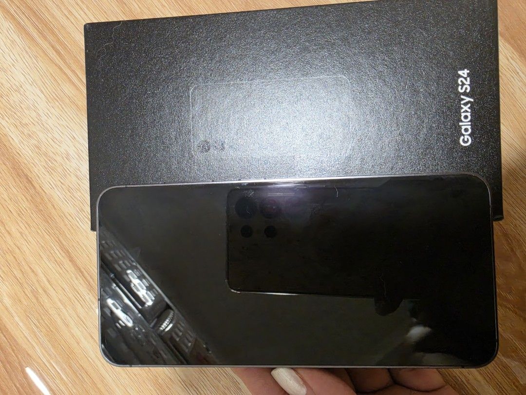 Samsung Galaxy S24 with Original Box (Category: Samsung) located in Makati City. Submitted by enjeirubi (Listing ID 1470144377, Image 1). Description: - Model: Samsung Galaxy S24 (Black) - Inclusion: Original black retail box - Status: Fully working, apps installed for testing, ready for use - Meetup or shipping options available -with small black dot in the bottom (samsung issue) -lady owned, smooth and no dents -Price is slightly negotiable.