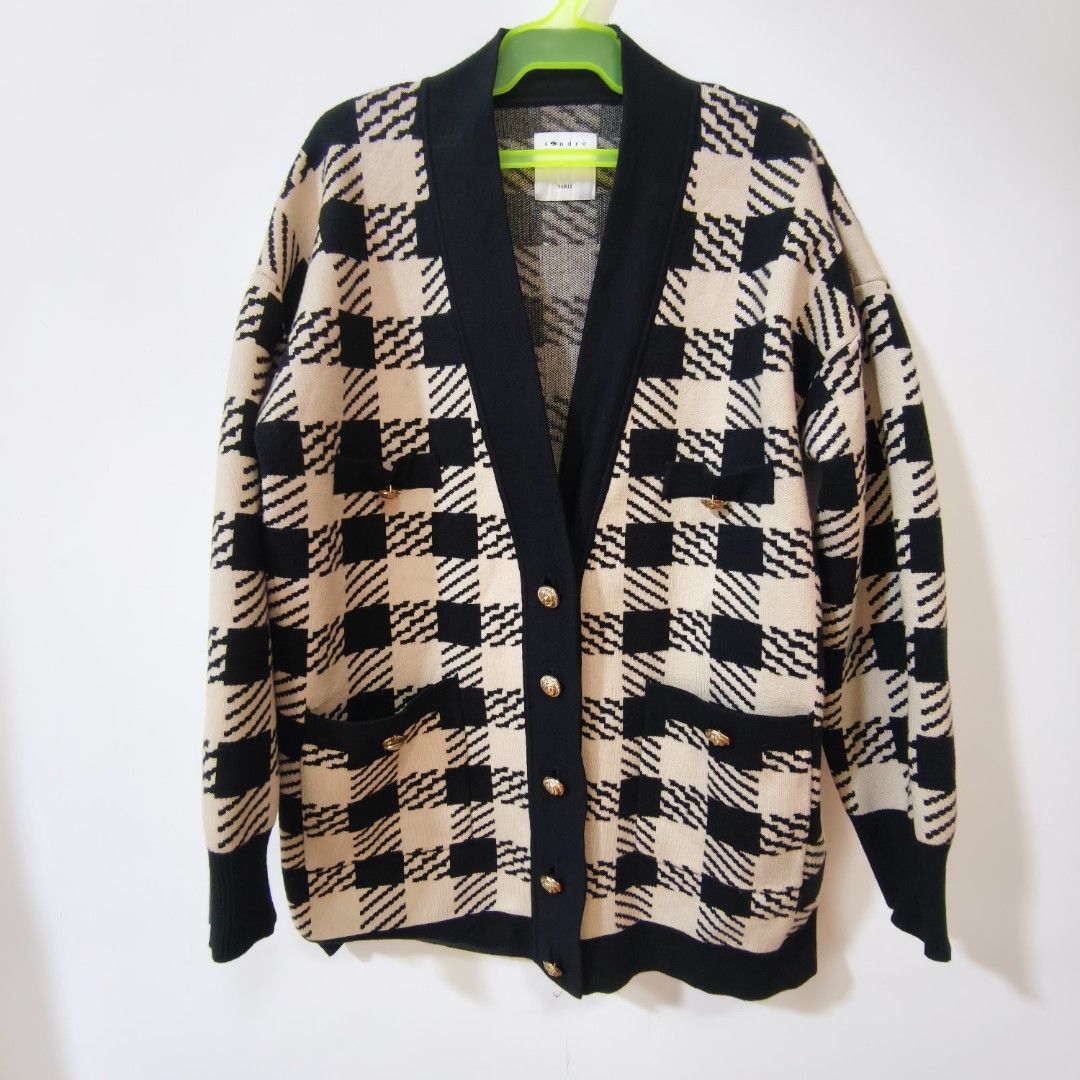 Sandro Paris Checkered Knit Cardigan Black Beige (Category: Coats, Jackets and Outerwear) located in Quezon City. Submitted by inrelationthrift (Listing ID 1470190865, Image 1). Description: -Sandro Paris knit cardigan in a bold black and beige checkered pattern. -V-neck style with black button placket and matching trim on pockets and cuffs. -Gold tone buttons down the front and on front pockets. Warm oversized fit with long sleeves. -Classic Par